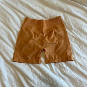 Alphalete orange gym shorts